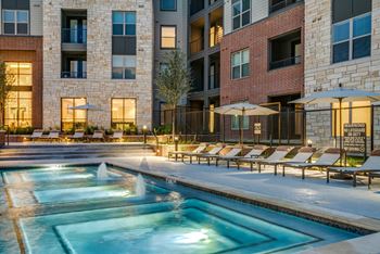 Resort-style swimming pool with sunning ledge, plunge pools, cabanas, and fire pit